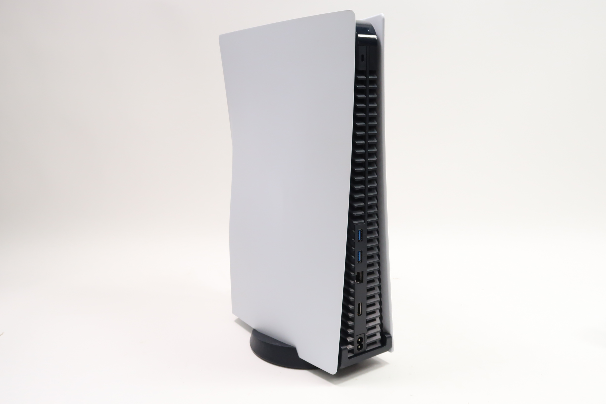 Side view of White PlayStation 5 Disc Edition Console with disc drive