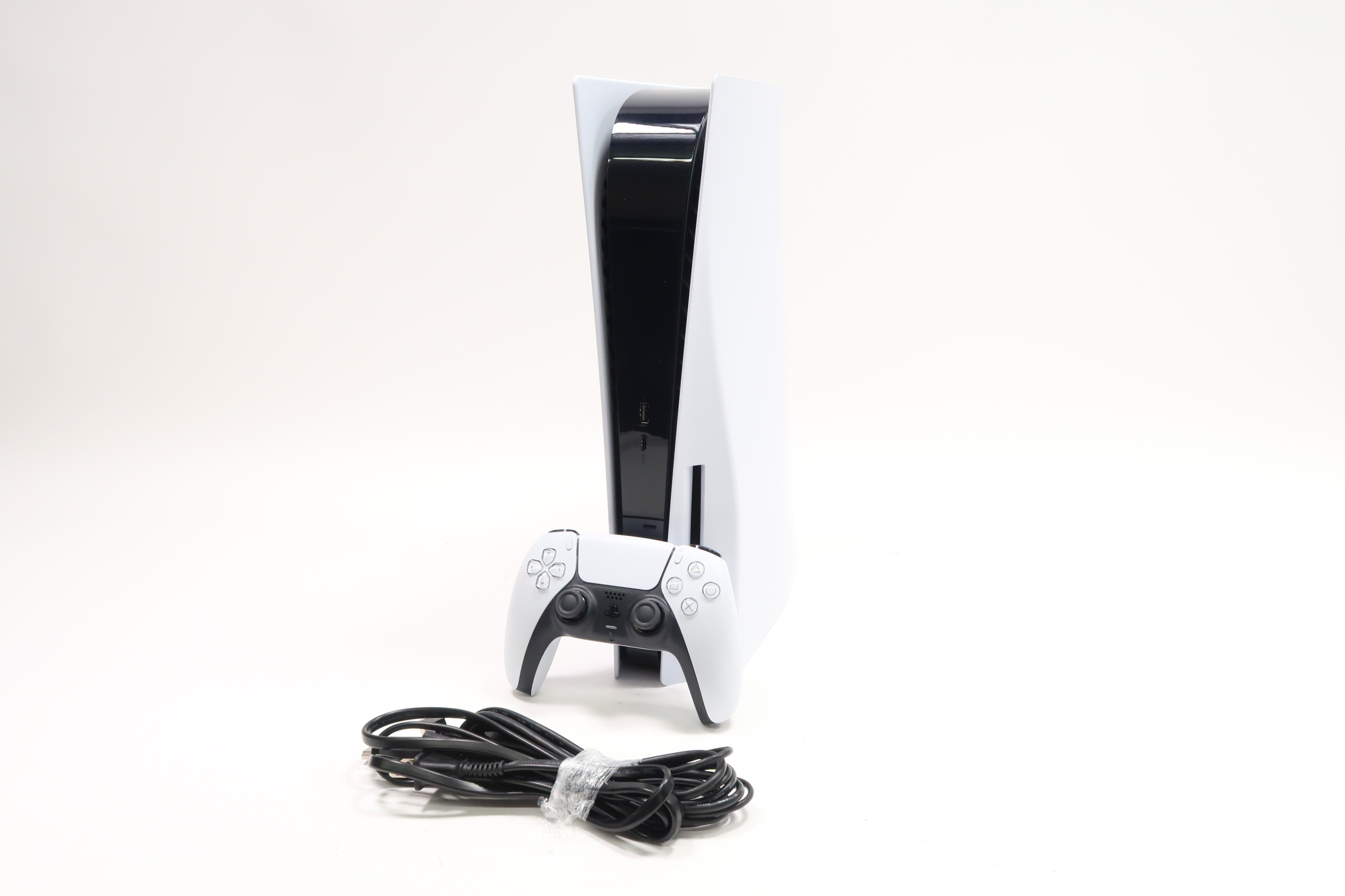 White PlayStation 5 Disc Edition Console with controller
